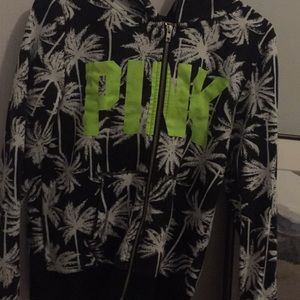 A PINK sweater with palm trees